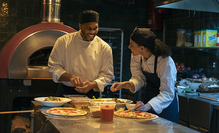 man and woman flirting in kitchen